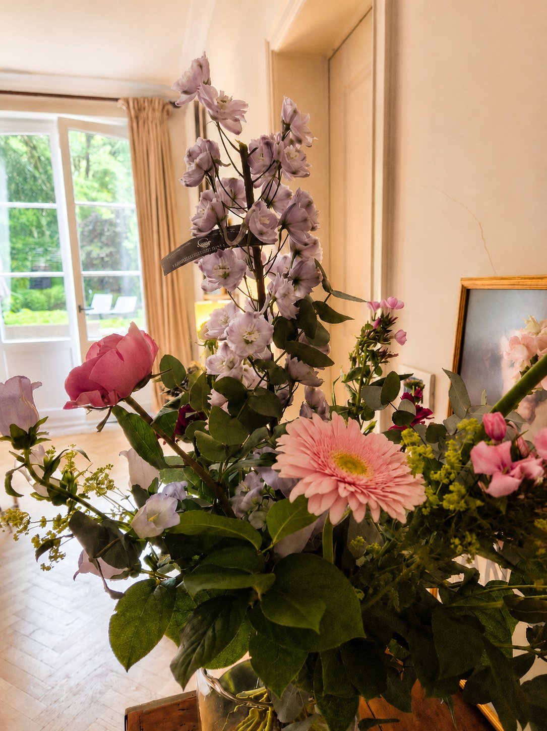 Fresh flowers in a warm interior before guests arrive.